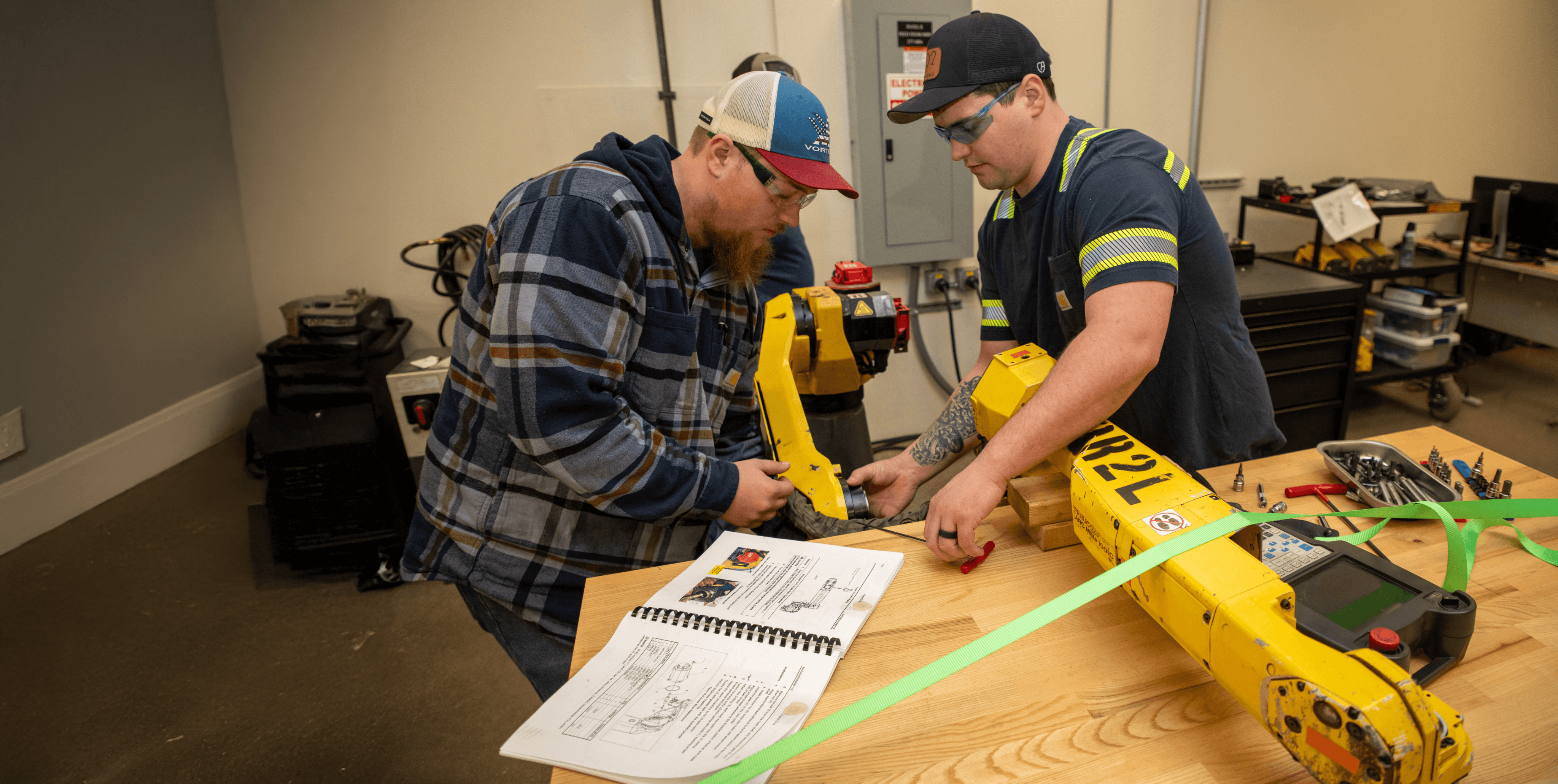 Students working with robotics equipment in a technical lab