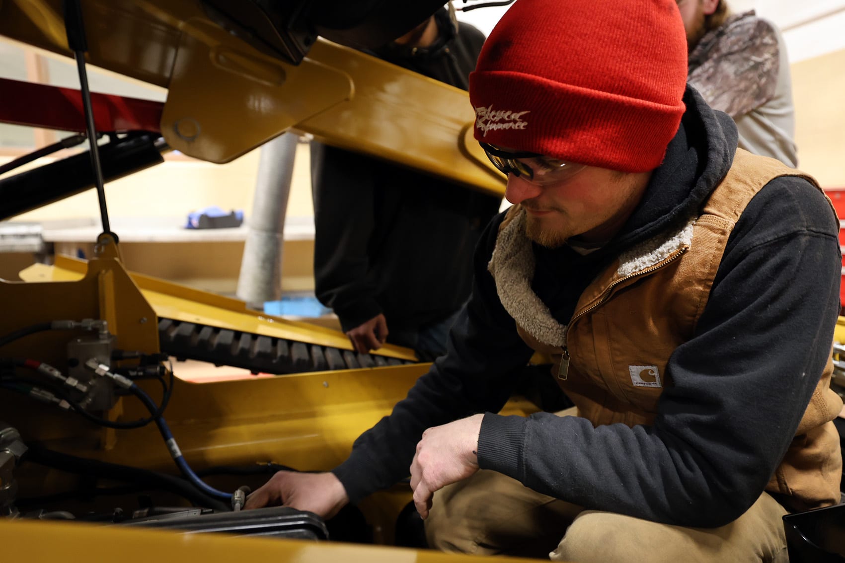 A diesel technology student working on equipment